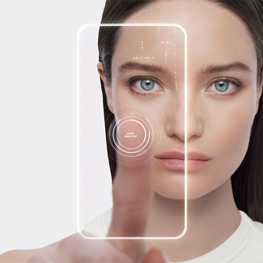AI skin analysis and virtual diagnostic tool. A woman using a facial scan app for a personalized skincare routine and custom skin management.