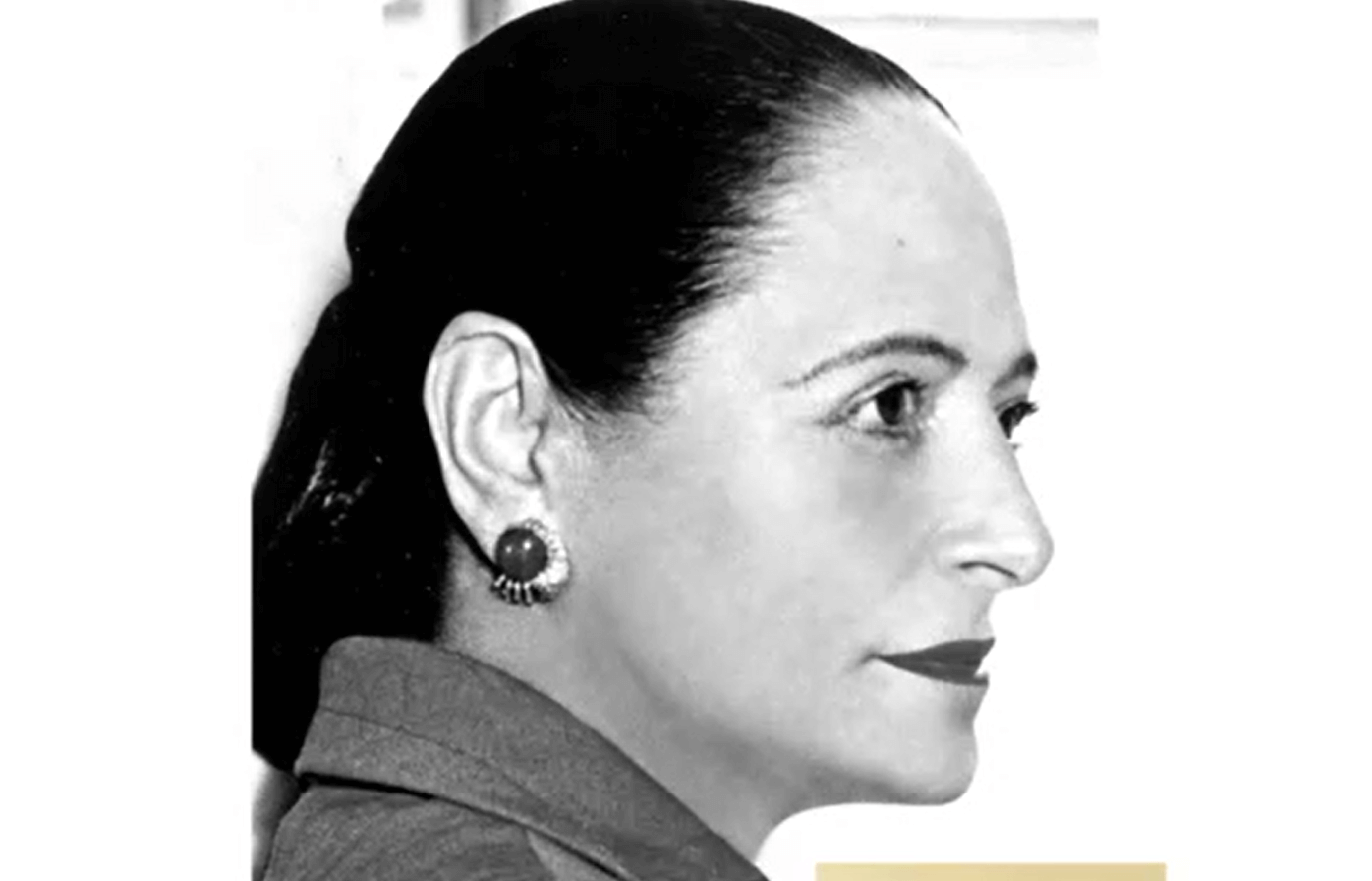 Black and white profile photo of a woman, likely Helena Rubinstein, looking to the right. She is wearing an earring and her hair is pulled back.
