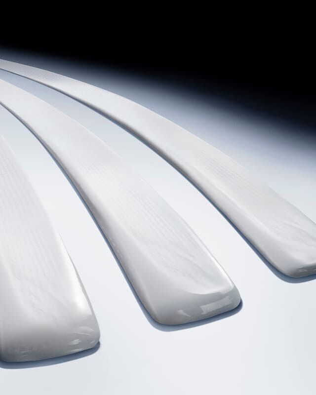 Three luxurious white cream swatches, showcasing a rich, smooth texture for Helena Rubinstein skincare.