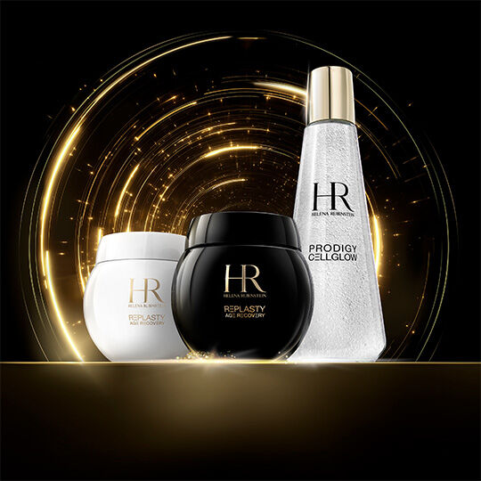 Helena Rubinstein Re-Plasty Age Recovery creams (black and white jars) and a Prodigy Cellglow bottle, set against a background of sparkling golden light on black.