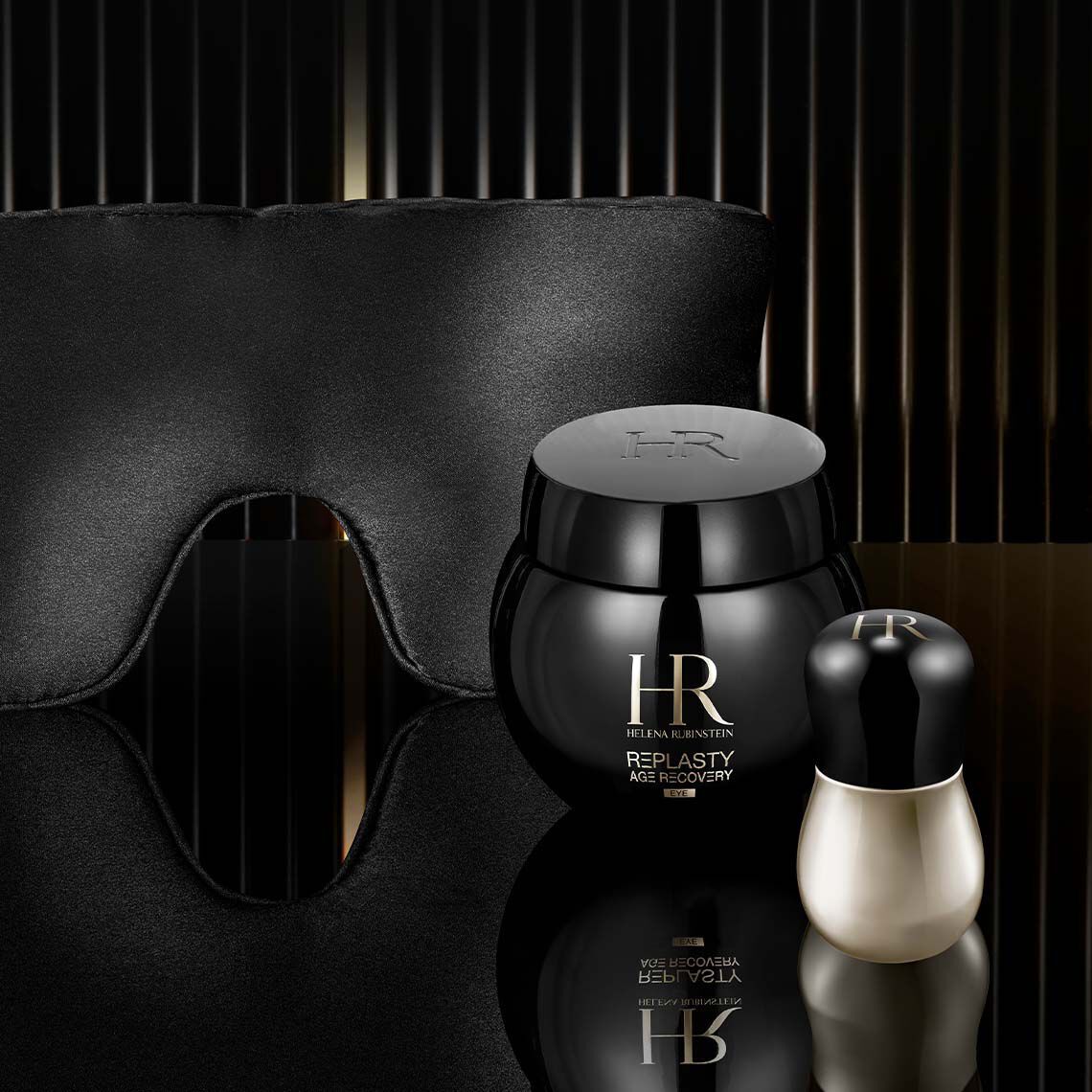 Helena Rubinstein Replasty Age Recovery Eye Night Care jar presented with a luxury silk sleeping mask and a precision applicator to illustrate a premium overnight eye repair ritual.