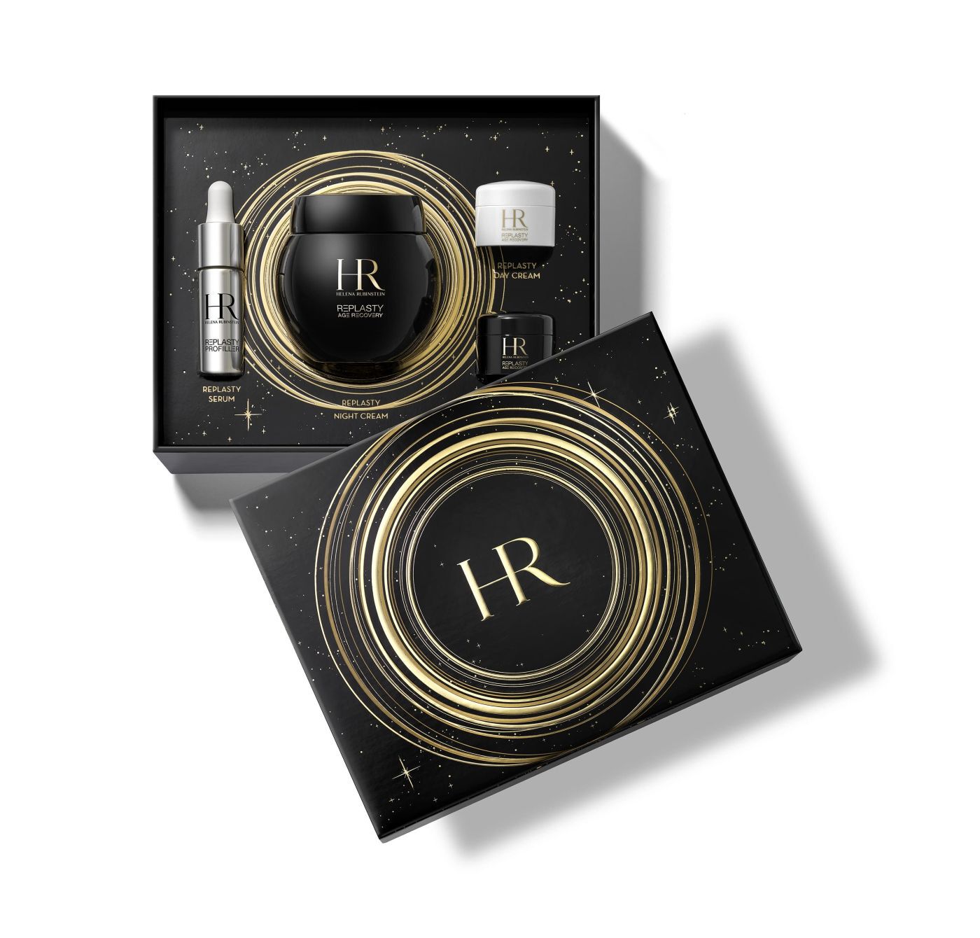 Black gift box lid with the golden "HR" logo centered, surrounded by luminous spirals and star patterns, on a reflective white background.