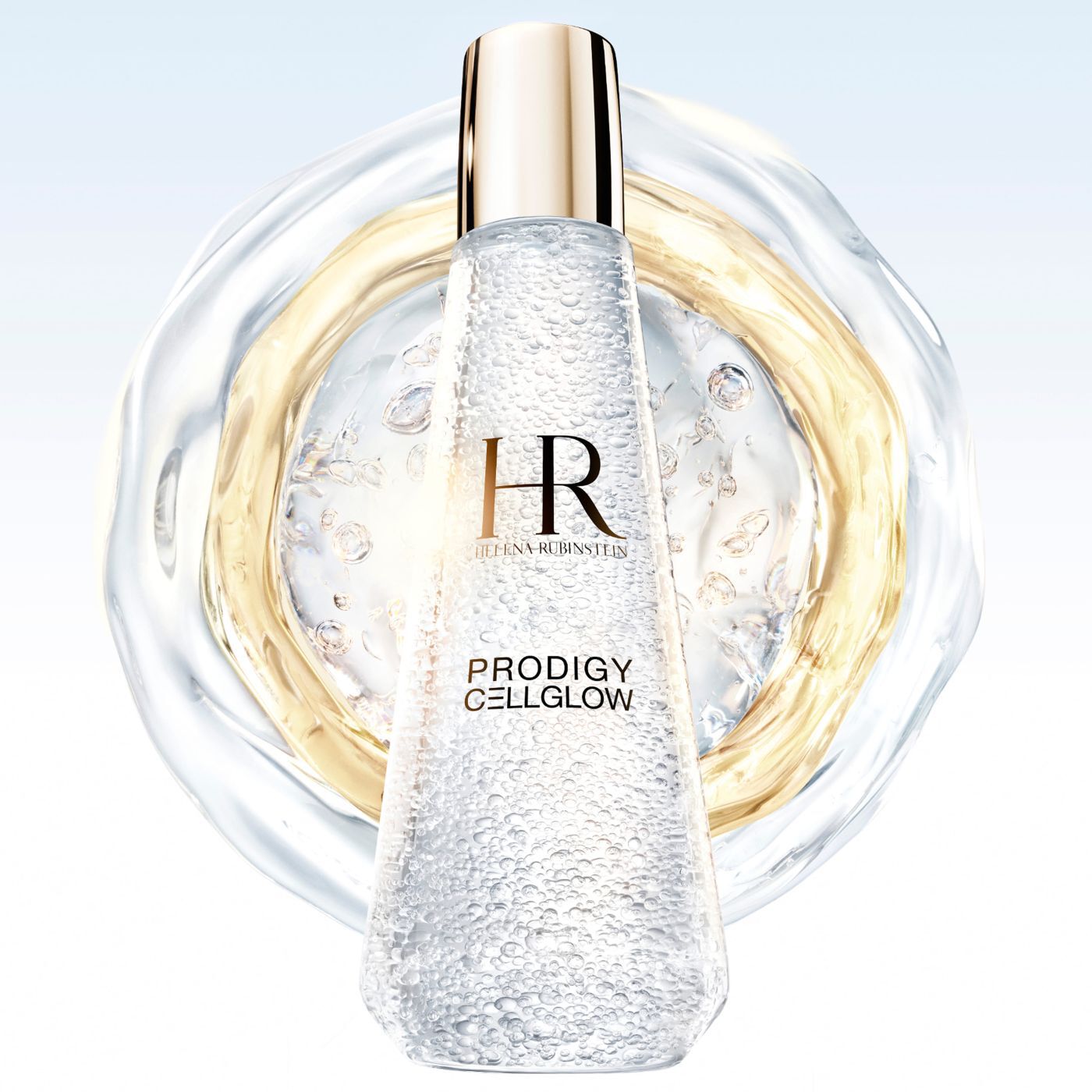 Helena Rubinstein Prodigy Cellglow" serum bottle filled with bubbles, centered within translucent and golden liquid rings extending across a light background.